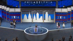 Workers prepare the stage at the Democratic National Convention at the Wells Fargo Center in Philadelphia, Pennsylvania, July 24, 2016.  
US Democrats converge on the City of Brotherly Love to elevate Hillary Clinton this coming week as the party's nominee who will battle Republican Donald Trump in 2016's presidential election. / AFP / SAUL LOEB        (Photo credit should read SAUL LOEB/AFP/Getty Images)