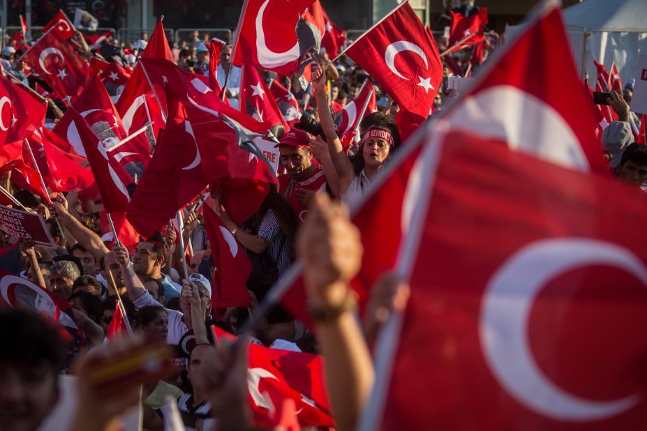 The mood at the demonstration, dubbed the "Republic and Democracy Rally," was celebratory and patriotic and a rare show of unity between government and opposition supporters.