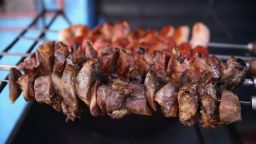 Local residents enjoy BBQ food ahead of the 2014 FIFA World Cup Brazil Group D match between England and Italy at Arena Amazonia on June 14, 2014 in Manaus, Brazil.  