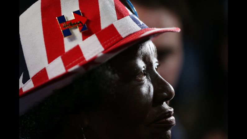 A delegate wears a pin showing her support of Clinton.