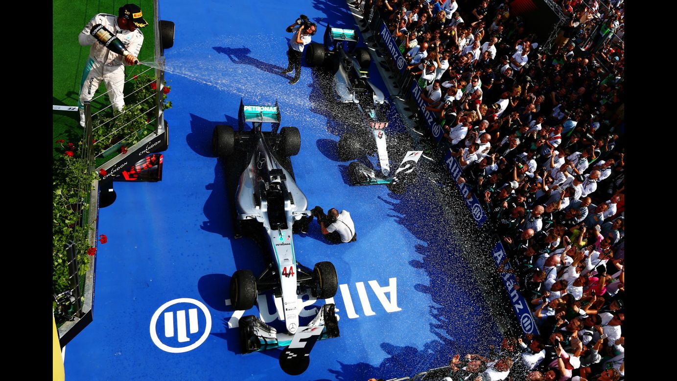 Formula One driver Lewis Hamilton celebrates on the podium after <a href="http://www.cnn.com/2016/07/24/motorsport/hungarian-grand-prix-lewis-hamilton/index.html" target="_blank">winning the Hungary Grand Prix</a> on Sunday, July 24. It was the third straight victory for Hamilton, the 2015 champion, and he is now in first place in the overall standings.
