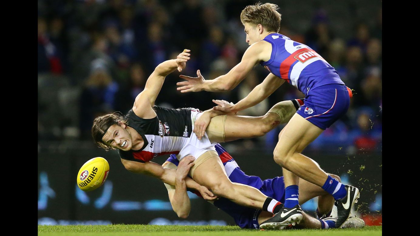 Maverick Weller of the St. Kilda Saints is tackled by Western Bulldogs during an Australian Football League match in Melbourne on Saturday, July 23. 