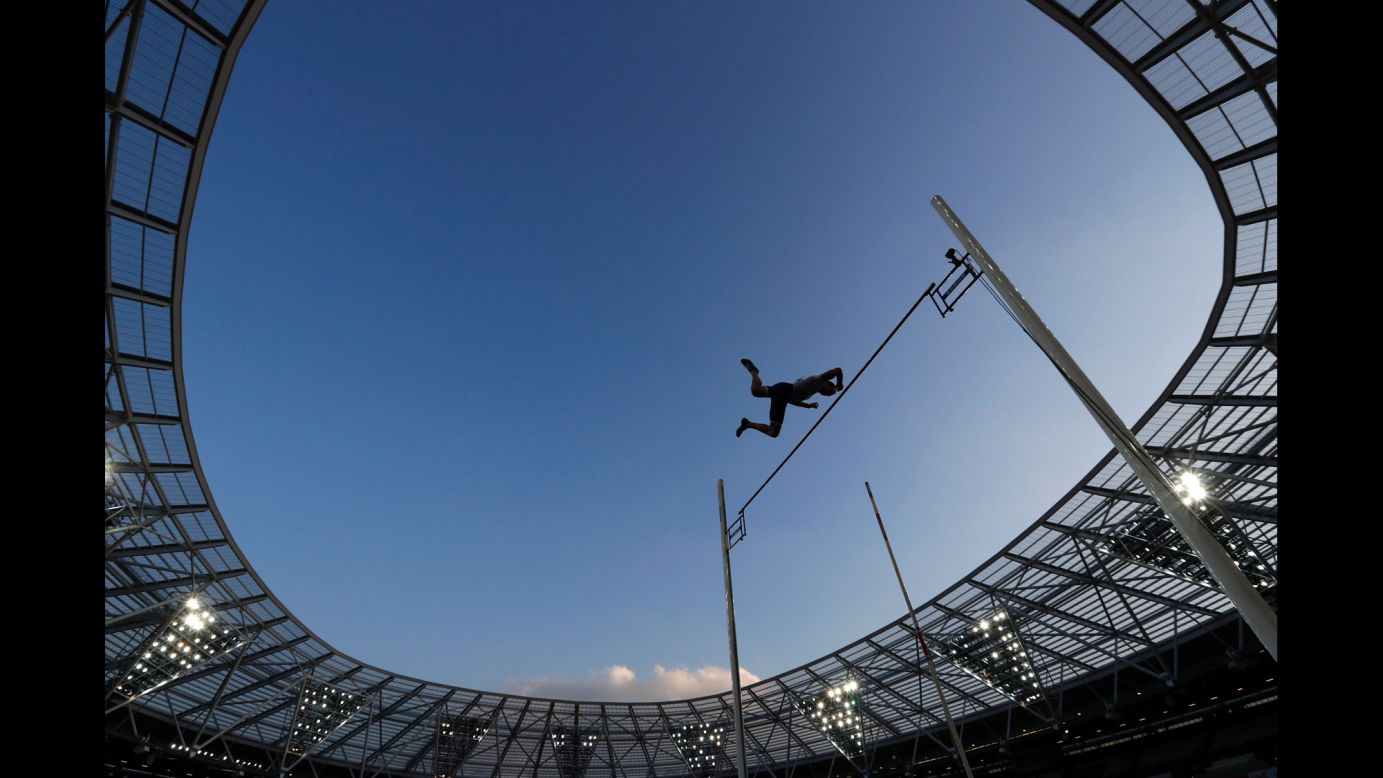 French pole vaulter Renaud Lavillenie -- the world-record holder in the event -- clears the bar during the Diamond League meet in London on Friday, July 22. He won with a jump of 5.9 meters (19.36 feet).  
