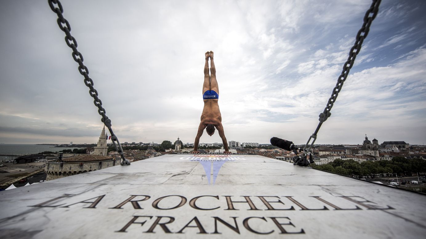 Czech diver Michal Navratil prepares to launch himself from a platform in La Rochelle, France, on Thursday, July 21. He was training at the fourth stop of the Red Bull Cliff Diving World Series.