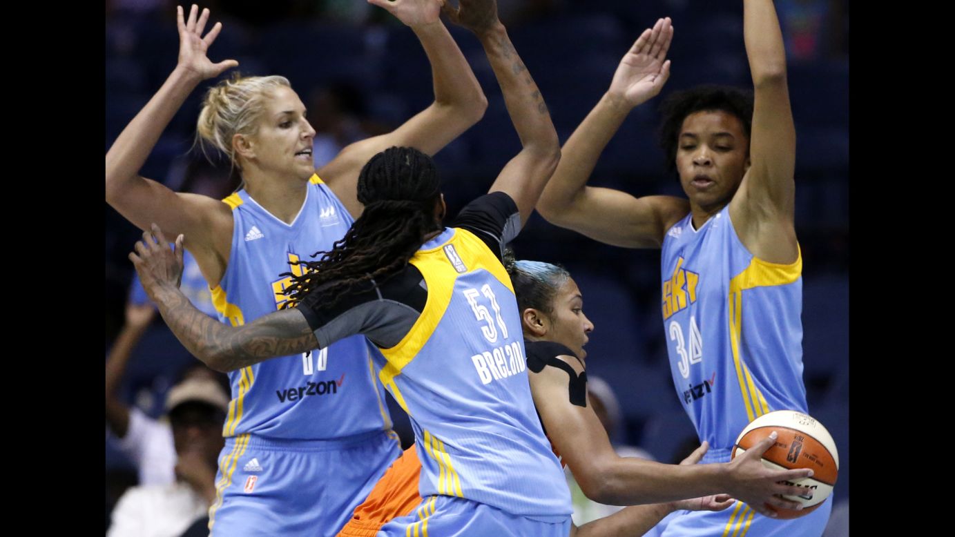 Connecticut's Alyssa Thomas is surrounded by Chicago Sky defenders during a WNBA game in Rosemont, Illinois, on Friday, July 22.