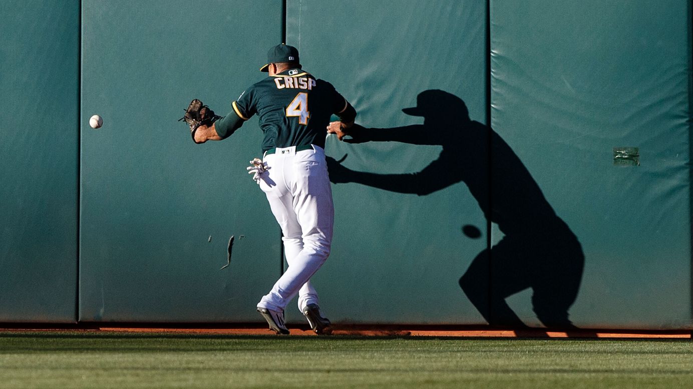 Oakland outfielder Coco Crisp is unable to catch a fly ball during a home game against Tampa Bay on Saturday, July 23.