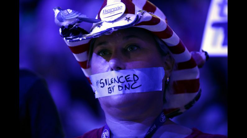 Tape on a delegate's mouth makes a statement Monday about the Democratic National Committee. Recently leaked committee emails <a href="index.php?page=&url=http%3A%2F%2Fwww.cnn.com%2F2016%2F07%2F22%2Fpolitics%2Fdnc-wikileaks-emails%2Findex.html" target="_blank">appeared to show favoritism toward Clinton</a> in the primary race, and many Sanders supporters entered the convention upset. The controversy has caused Debbie Wasserman Schultz to step down as the committee's chairwoman at the end of the convention.