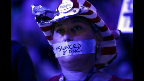 Tape on a delegate's mouth makes a statement Monday about the Democratic National Committee. Recently leaked committee emails <a href="http://www.cnn.com/2016/07/22/politics/dnc-wikileaks-emails/index.html" target="_blank">appeared to show favoritism toward Clinton</a> in the primary race, and many Sanders supporters entered the convention upset. The controversy has caused Debbie Wasserman Schultz to step down as the committee's chairwoman at the end of the convention.