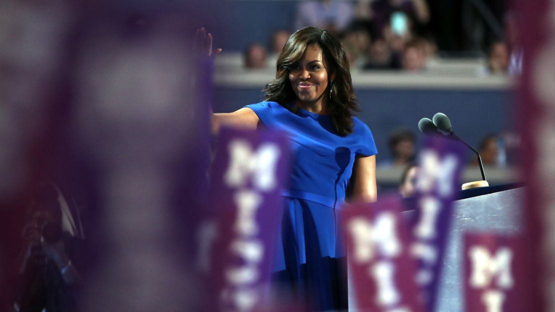 First lady Michelle Obama waves to the crowd before delivering remarks on the first day of the Democratic National Convention at the Wells Fargo Center, July 25, 2016 in Philadelphia, Pennsylvania.
