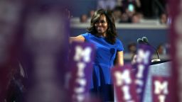 First lady Michelle Obama waves to the crowd before delivering remarks on the first day of the Democratic National Convention at the Wells Fargo Center, July 25, 2016 in Philadelphia, Pennsylvania. An estimated 50,000 people are expected in Philadelphia, including hundreds of protesters and members of the media. The four-day Democratic National Convention kicked off July 25. 