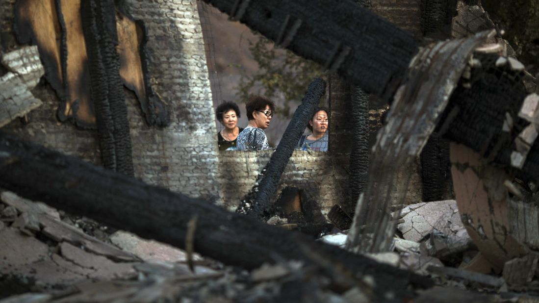 Residents return to a home that was destroyed by fire in Santa Clarita. 