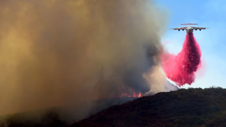 A plane drops fire retardant in the mountains near Santa Clarita.