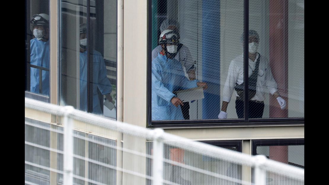 Rescue workers are seen at the Tsukui Yamayuri-en care center 