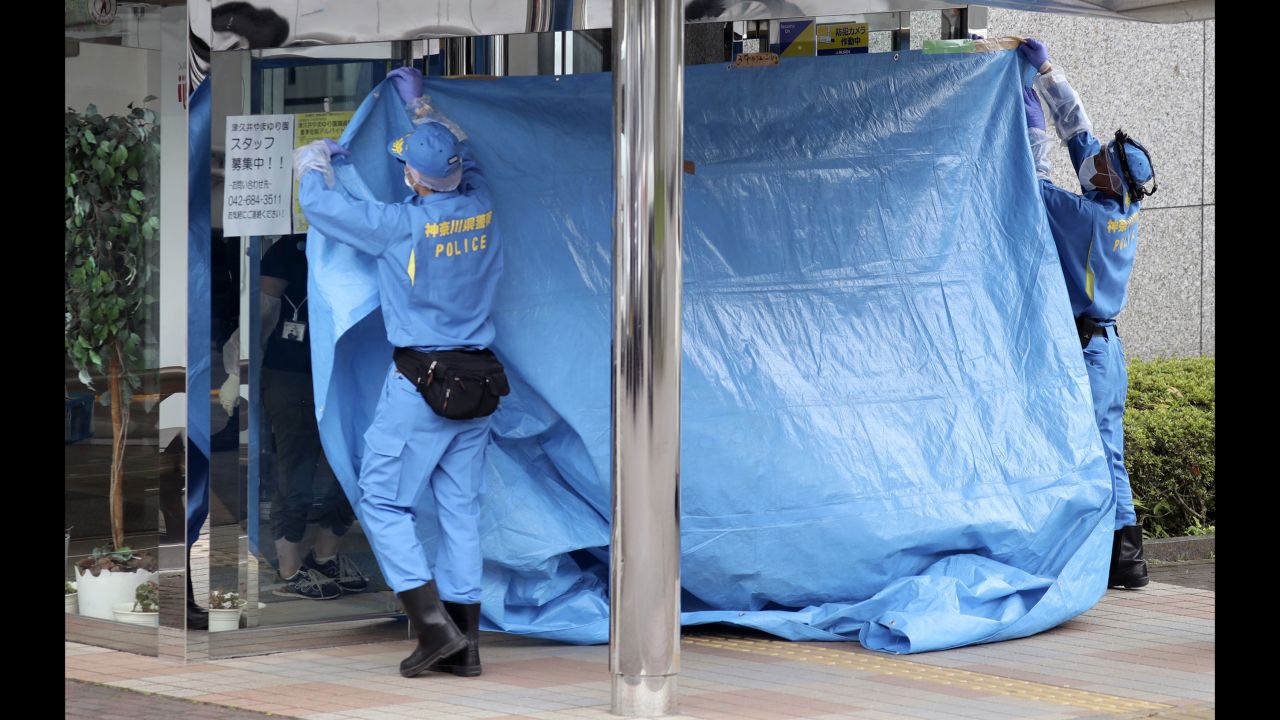 Investigators cover the entrance of the Tsukui Yamayuri-en center following the attack. Among the dead were nine men and 10 women, ranging in age from 18 to 70.