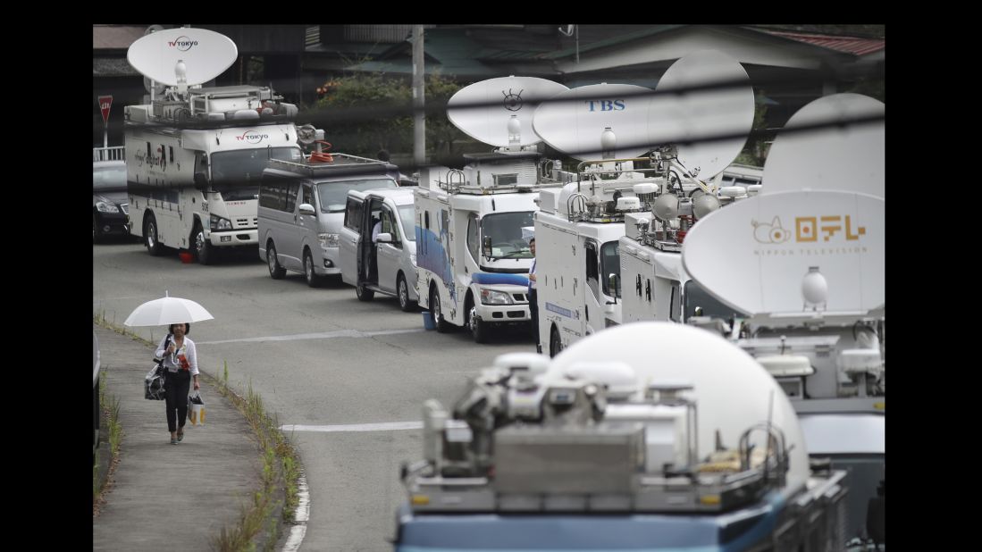 A  convoy of media broadcast vans converges on the scene of the crime, which sent shock waves through Japan, where gun ownership is highly restricted and mass killings are rare.