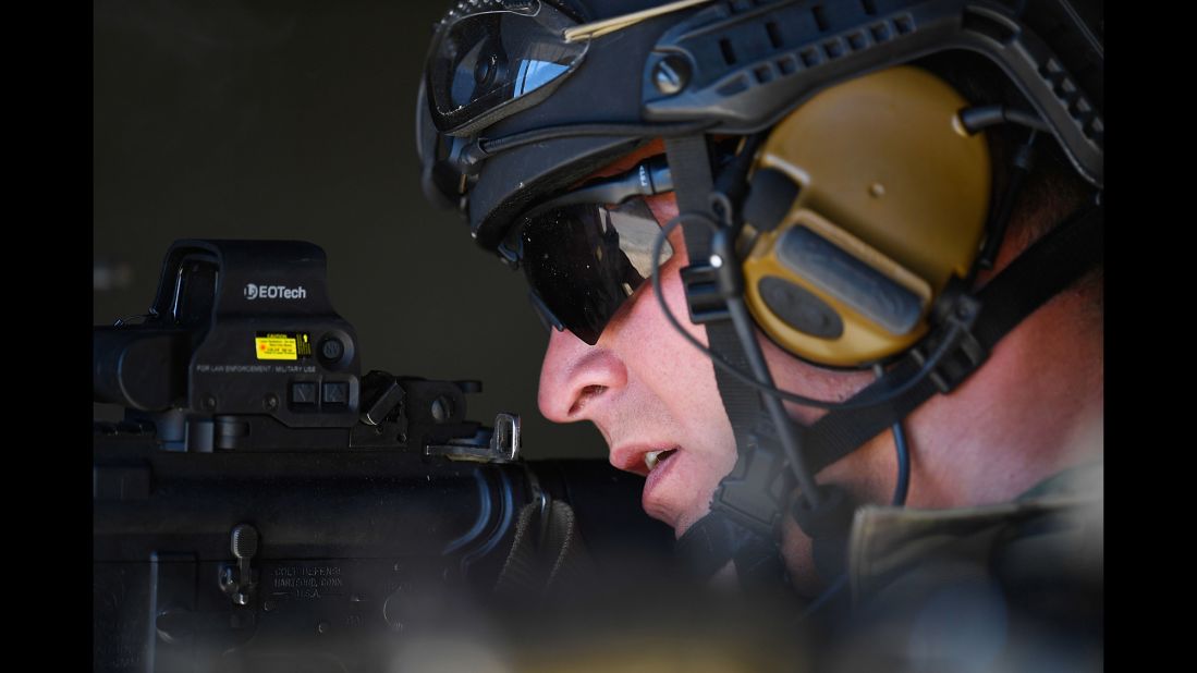 A member of the U.S. Air Force focuses on a simulated enemy during a training exercise in Townsville, Australia, on Wednesday, July 6.