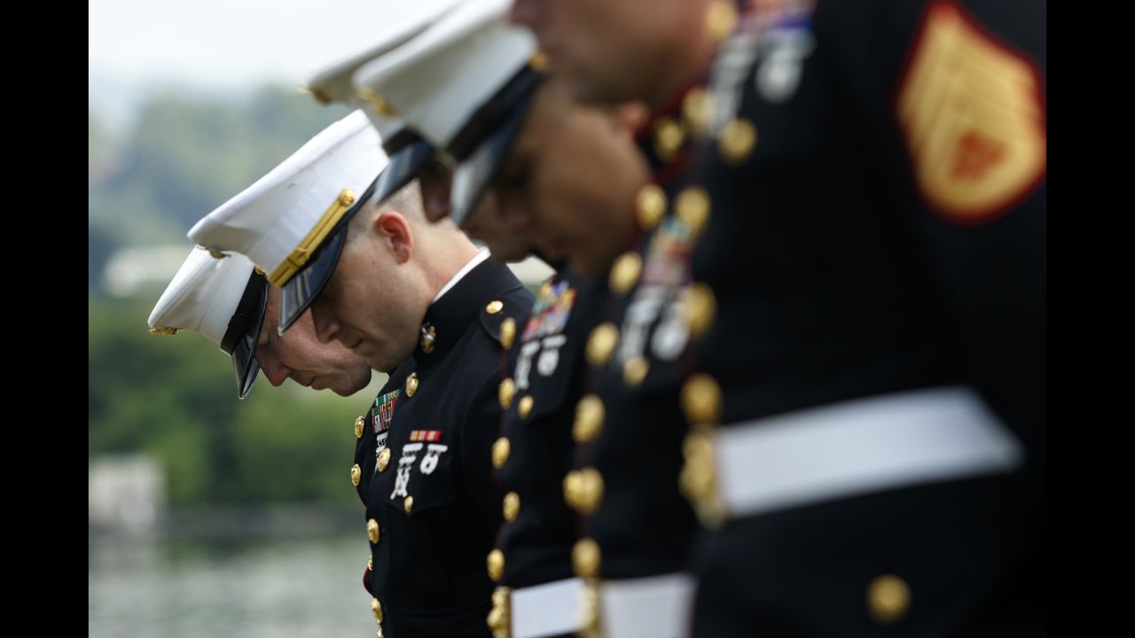 U.S. Marines bow their heads during a memorial service in Chattanooga, Tennessee, on Saturday, July 16. The service marked one year since <a href="http://www.cnn.com/2015/07/20/us/tennessee-naval-reserve-shooting/" target="_blank">four Marines and a sailor were killed by a lone gunman</a> who shot up a military recruiting center and a local Navy operations support center.