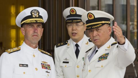 Wu Shengli, commander of the Chinese Navy, points out the layout of the Chinese Navy headquarters as he welcomes Adm. John Richardson, the chief of U.S. naval operations, to Beijing on Monday, July 18.
