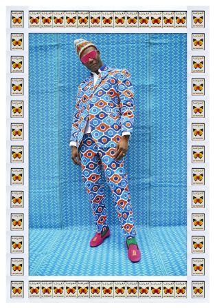 Fashion designer Joe Casely-Hayford wears a suit made of canopy fabric, commonly used for little shops in Moroccan medinas. "Joe is a famous British fashion designer so it fitted very well in the context of the exhibition," says Hajjaj. Although they appear as studio portraits, most of Hassan Hajjaj's images are taken on the streets. 