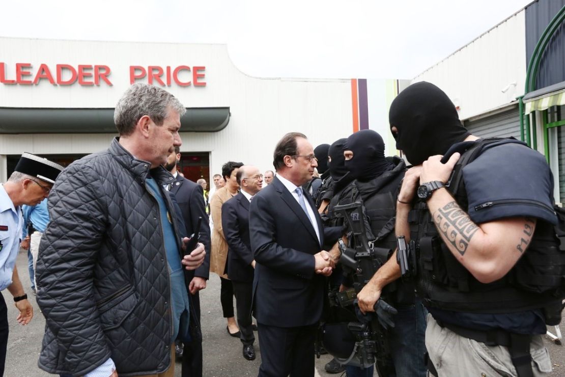 French President Francois Hollande meets police who responded to the attack in Saint-Etienne-du-Rouvray.