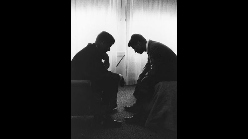 Presidential candidate John F. Kennedy, left, confers with his younger brother and campaign manager, Robert, in a Los Angeles hotel suite in July 1960. It was the week of the Democratic National Convention.