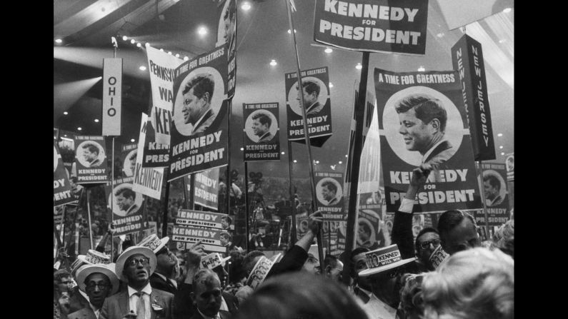 Kennedy supporters hold signs reading, "A time for greatness: Kennedy for President." Most of the convention was held at the newly opened Los Angeles Memorial Sports Arena, which later became the home of the Los Angeles Lakers and Clippers.