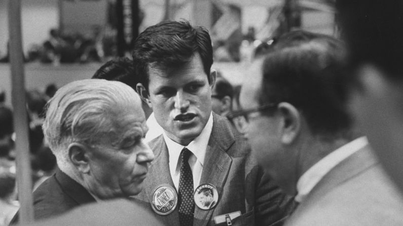 The youngest Kennedy brother, Ted, speaks to delegates on the convention floor. The 28-year-old, who later became a senator himself, helped run his brother's presidential campaign in western states.