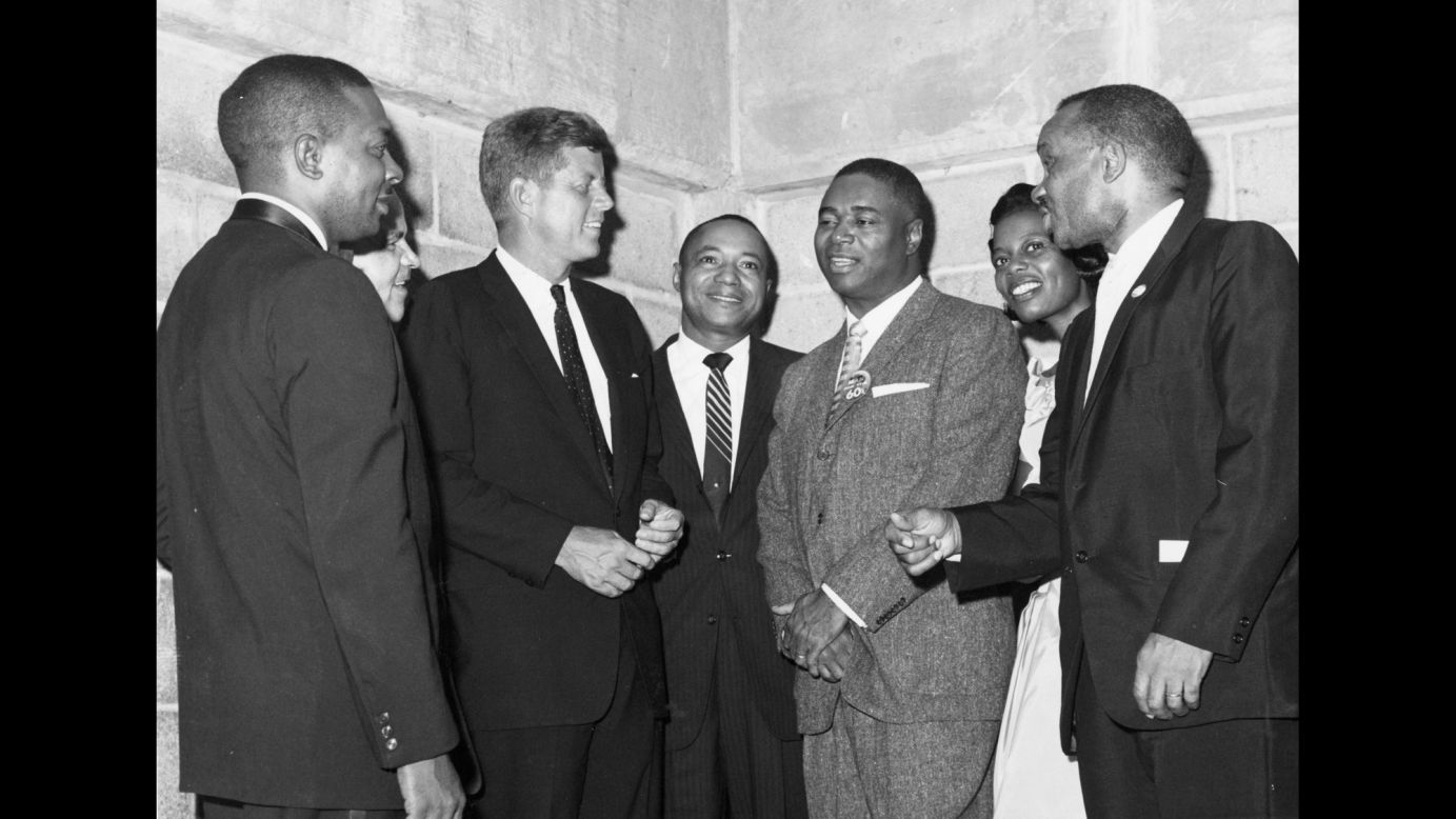 Kennedy meets with a group of delegates at the convention. Kennedy became the youngest President ever elected in November, and the African-American vote went heavily for Kennedy over Richard M. Nixon.