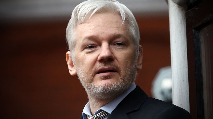 Wikileaks founder Julian Assange speaks from the balcony of the Ecuadorian embassy where  he continues to seek asylum following an extradition request from Sweden in 2012, on February 5, 2016 in London, England