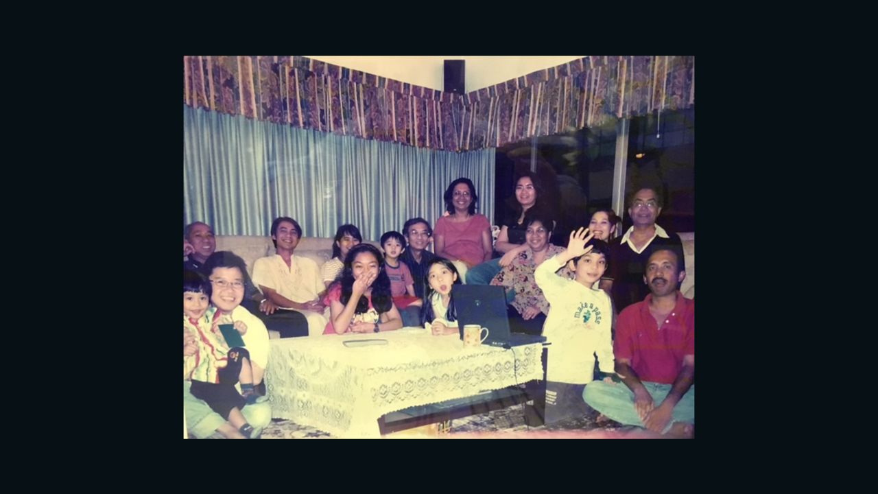Malaysia Airlines flight 370 pilot Zaharie Ahmad Shah seen in a family photo (far right, seated) provided by his sister (middle back).