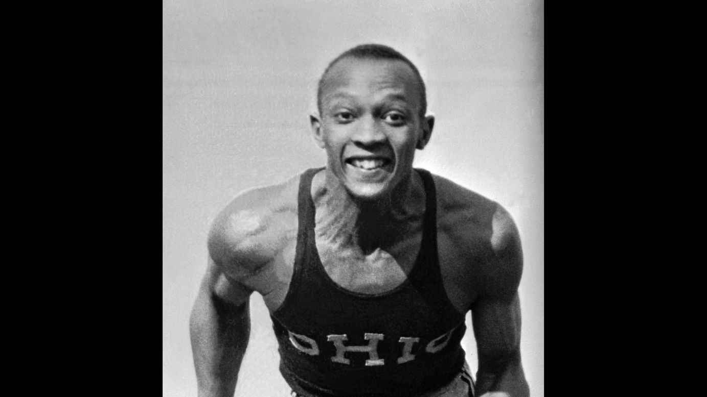 Owens poses in his Ohio State track jersey in April 1935. His full name was James Cleveland (J.C.) Owens. He got the nickname Jesse from his first schoolteacher in Cleveland. She misunderstood Owens when he said J.C., and <a href="http://www.jesseowens.com/about/" target="_blank" target="_blank">she put his name down as Jesse.</a>