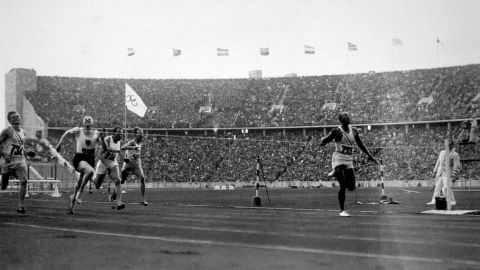 Owens wins the 100 metres at the 1936 Olympics in Berlin