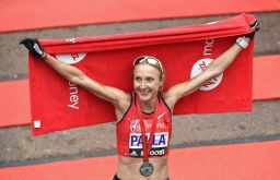 Radcliffe poses for photos after competing in the 2015 London Marathon.