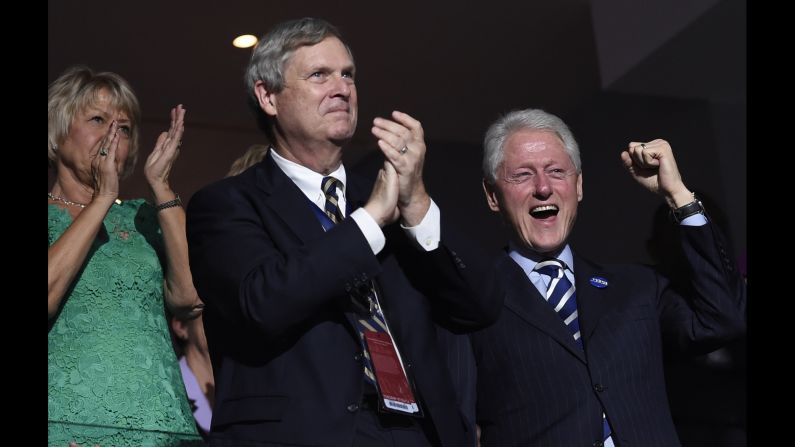 Former U.S. President Bill Clinton, right, cheers during the speech of former New York City Mayor Michael Bloomberg.