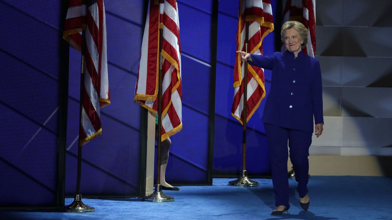 Clinton points to Obama as she walks on stage after his speech.