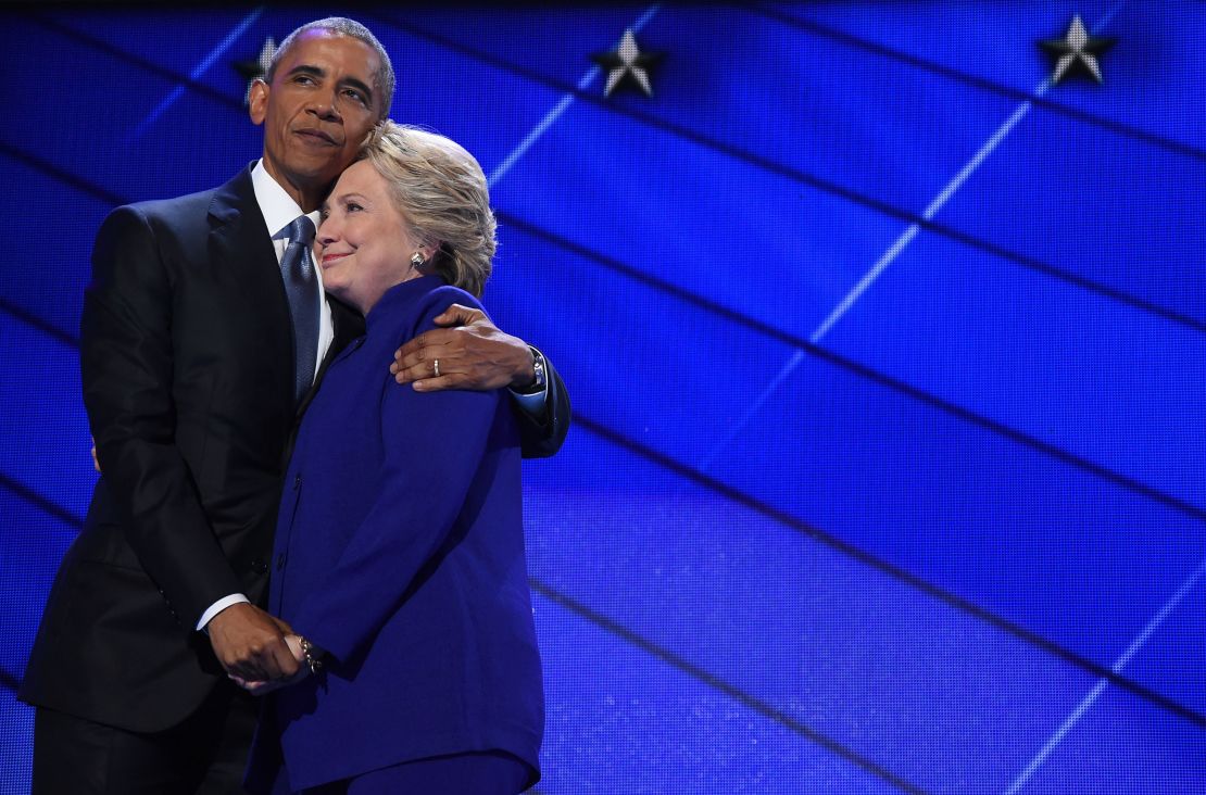 Obama hugs Clinton during the third night of the Democratic National Convention in Philadelphia, Pennsylvania.