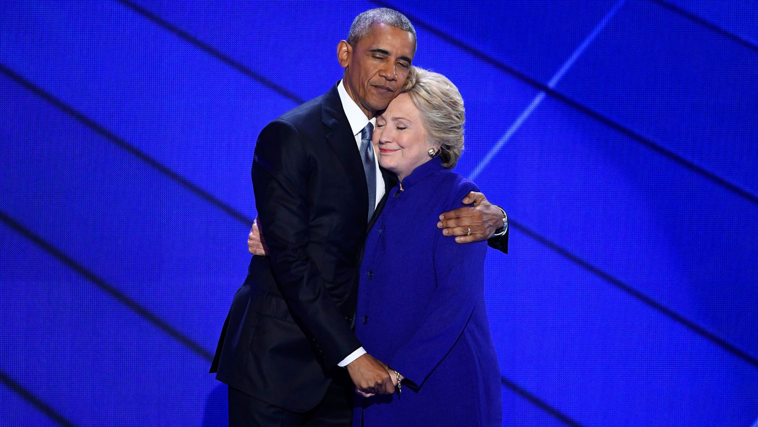 In a symbol of American optimism and activism, President Barack Obama embraces Hillary Clinton at the Democratic National Convention.