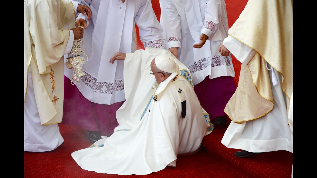 Pope Francis takes a fall during Mass in Czestochowa, Poland.