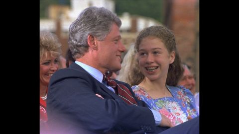 Chelsea, 12, speaks with her dad before a campaign rally in Hot Springs, Arkansas, in September 1992. He was running for President at the time.