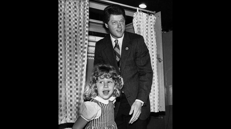 Chelsea, 6, and her father leave the voting booth after he cast a primary vote in May 1986.