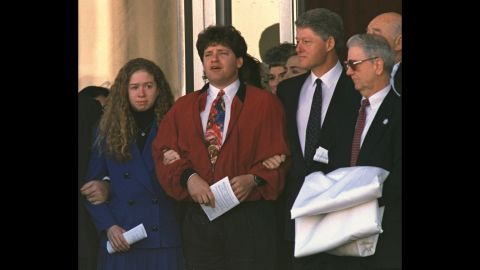 Chelsea holds the arm of her uncle Roger as the family leaves funeral services for the President's mother, Virginia Kelley, in January 1994.