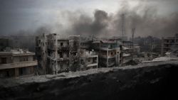 Smoke rises from an Aleppo neighborhood in this file picture.