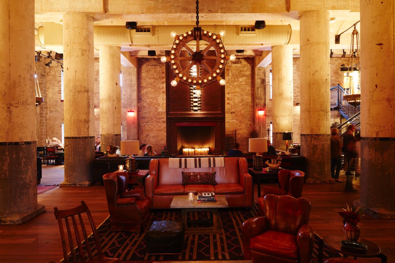 Located in an 1894 brew house, Hotel Emma in San Antonio folds elements of the building's past into its decor. A light fixture at hotel bar Sternewirth incorporates components once used in the brewery's bottling room.