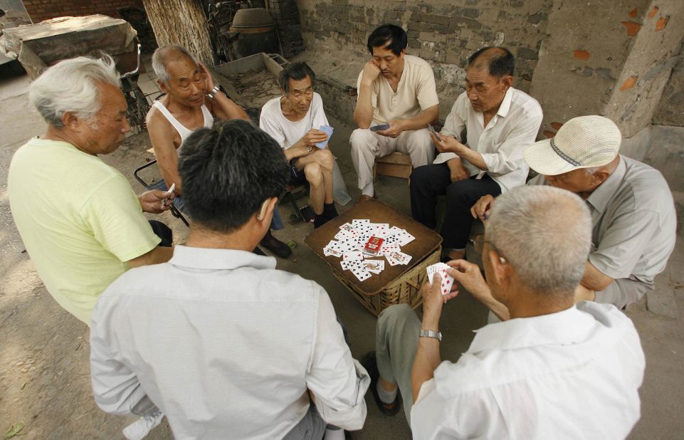 The Hutong neighborhoods have historically supported a communal way of life, with neighbors playing traditional games together. 