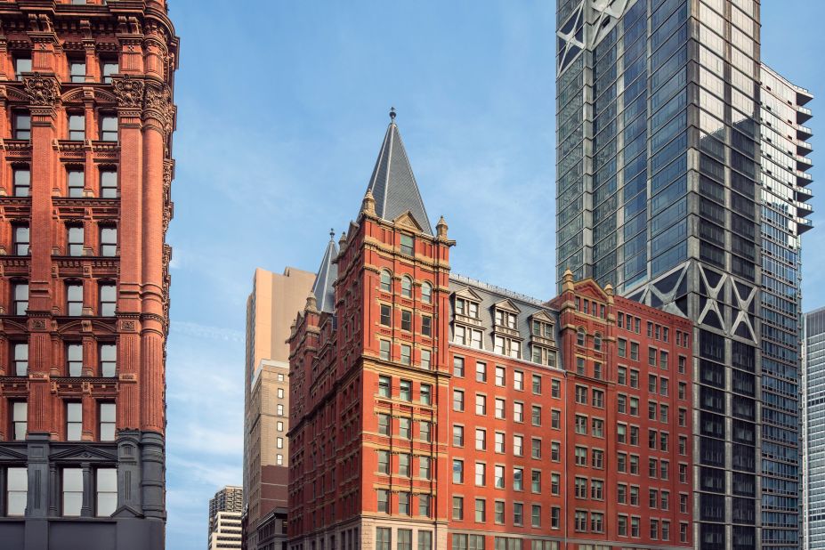 Construction of the turreted, red brick Temple Court Building, right, started in 1881 in Lower Manhattan. The building is on the verge of opening as a 287-room hotel called The Beekman.