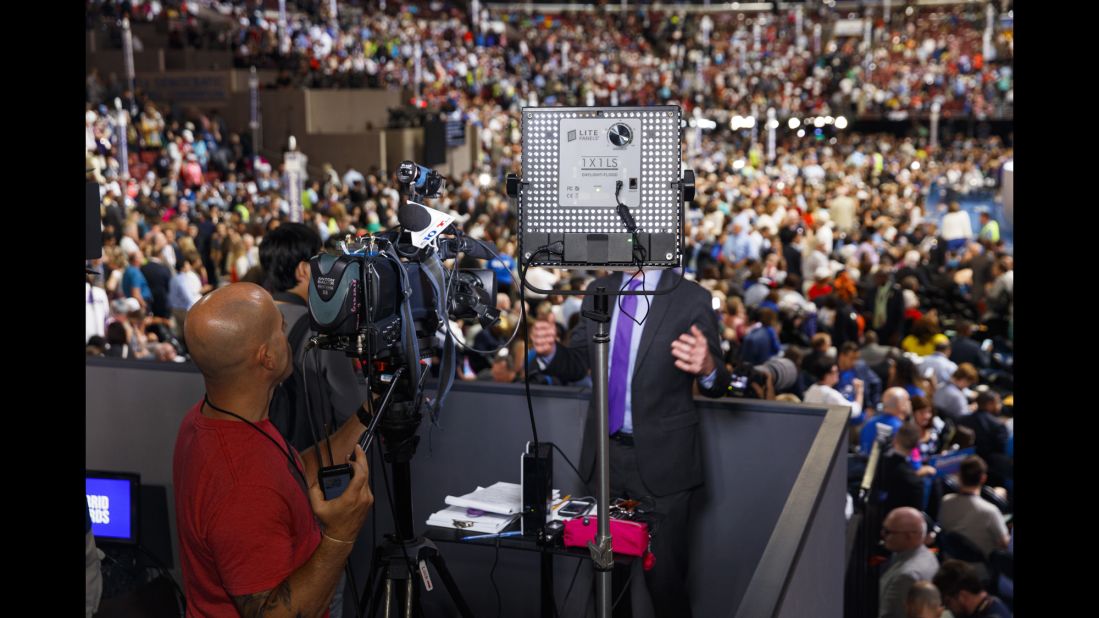 NBC 10 Philadelphia broadcasts from a press stand above the floor of the Democratic National Convention.