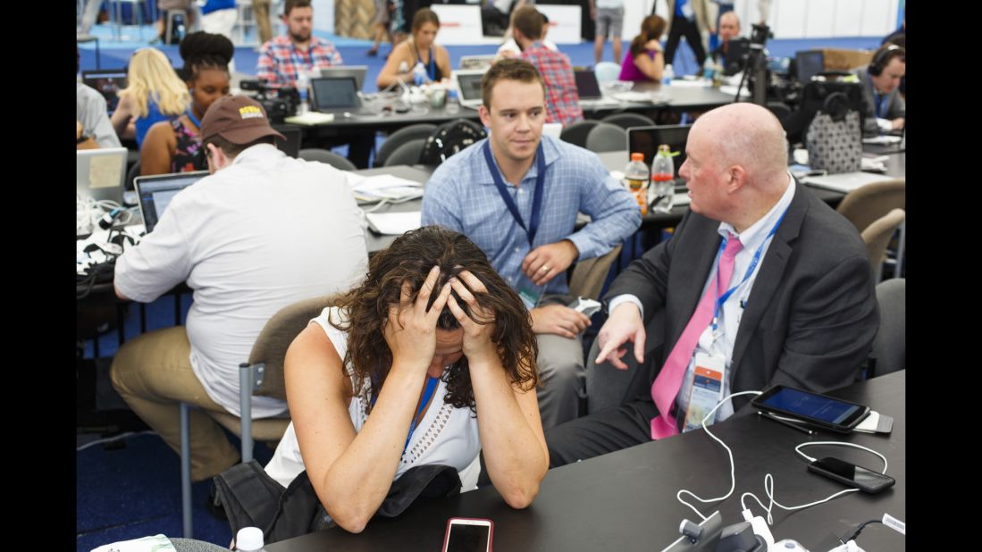Journalists work inside a media tent outside the arena.