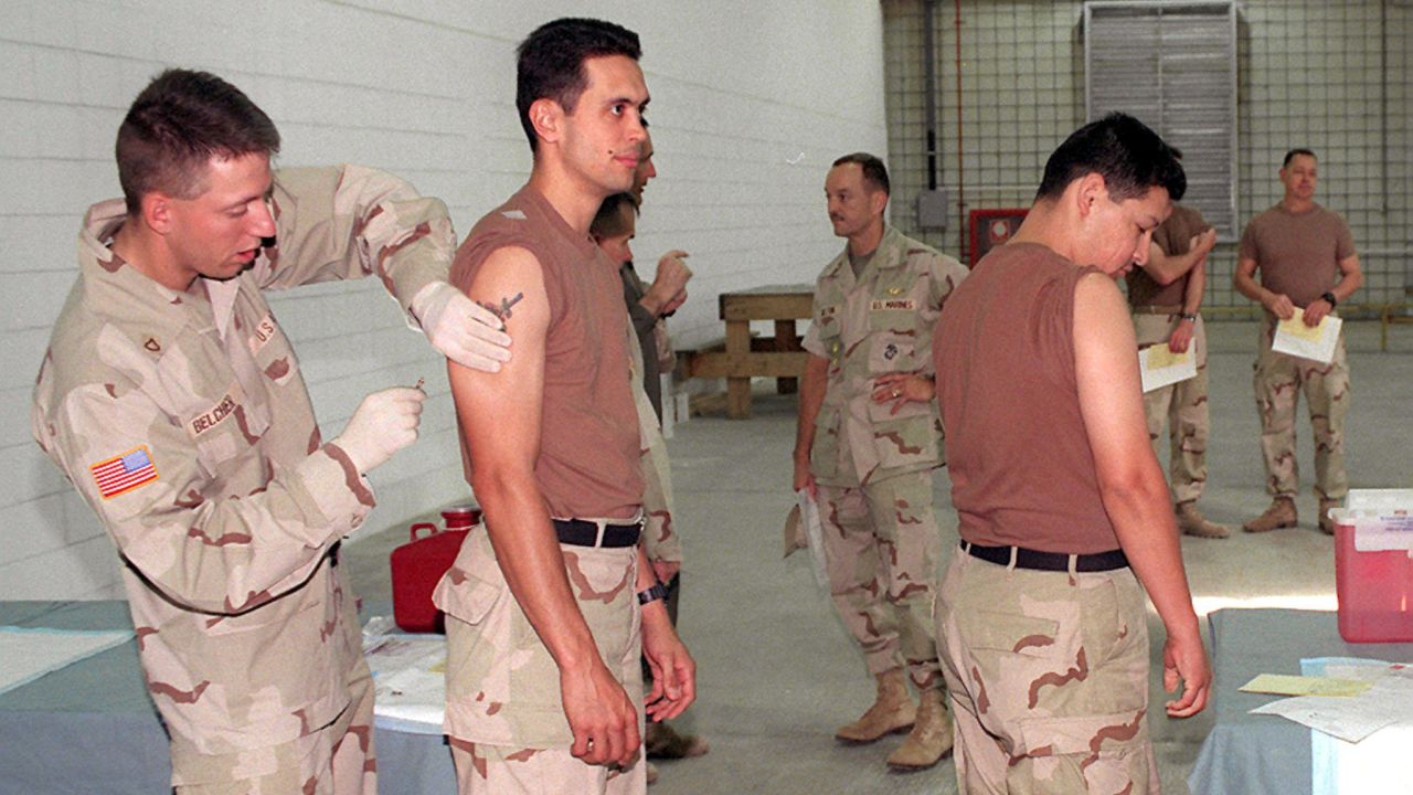 American soldiers in Kuwait City receive anthrax vaccinations in March 1998.