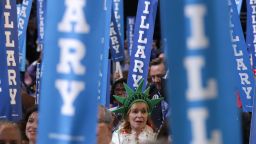 Delegates cheer on the fourth day of the Democratic National Convention at the Wells Fargo Center, July 28, 2016 in Philadelphia, Pennsylvania. Democratic presidential candidate Hillary Clinton received the number of votes needed to secure the party's nomination. An estimated 50,000 people are expected in Philadelphia, including hundreds of protesters and members of the media. The four-day Democratic National Convention kicked off July 25.