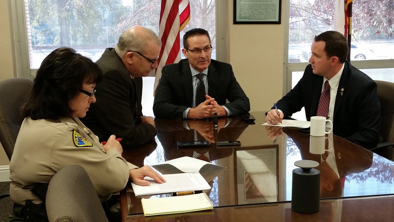 From left, Tulare County Sheriff's Captain Cheri Lehner, Undersheriff Robin Skiles, Sheriff Mike Boudreaux and State Assemblyman Devon Mathis, discuss the nut theft problem. 
